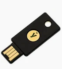 A black usb flash drive with a yellow circle and a gold circle

Description automatically generated